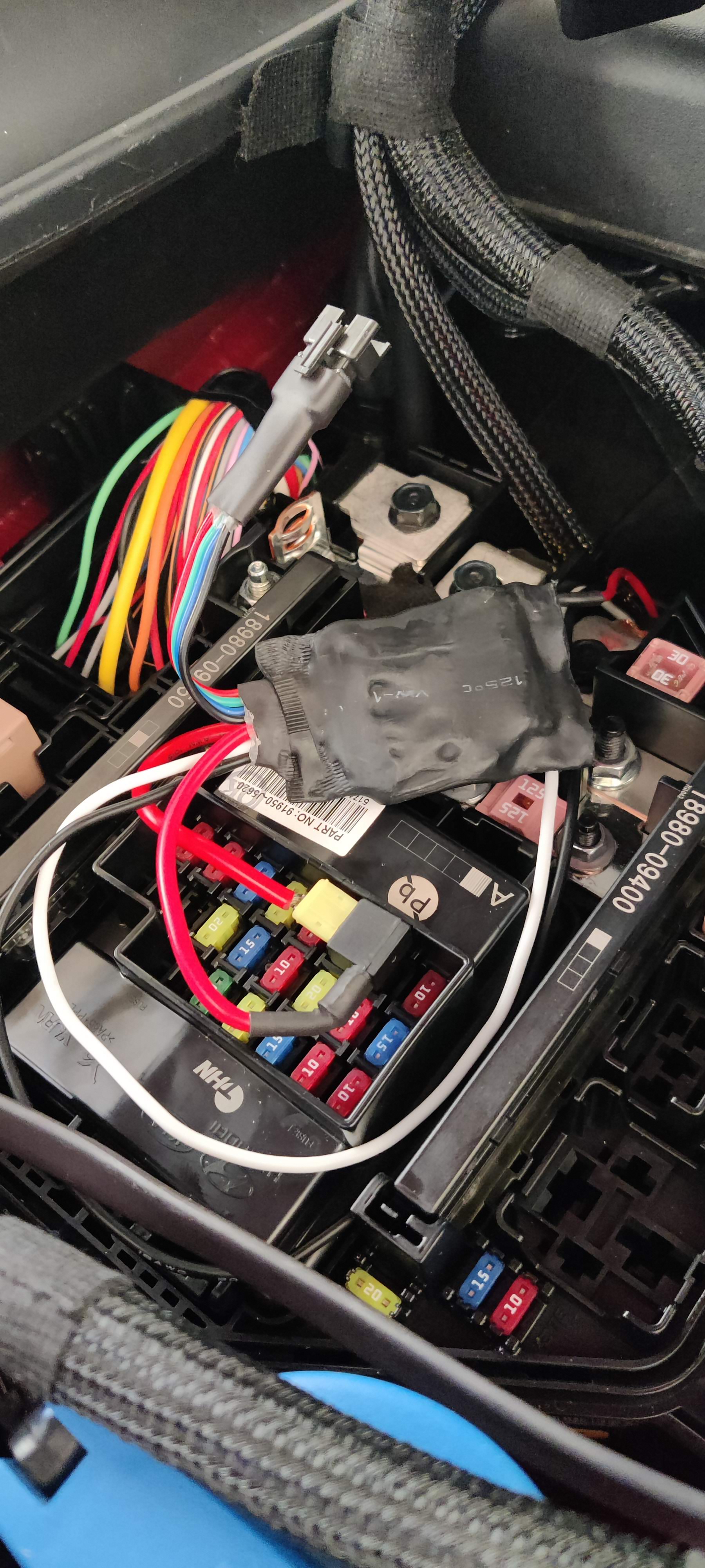 Figure 2. Connecting LEDfoot Inside the Engine Bay Fuse Box (This is a Photo of a Pre-Production Unit and Does Not Accurately Reflect the Appearance of the Production Unit)
